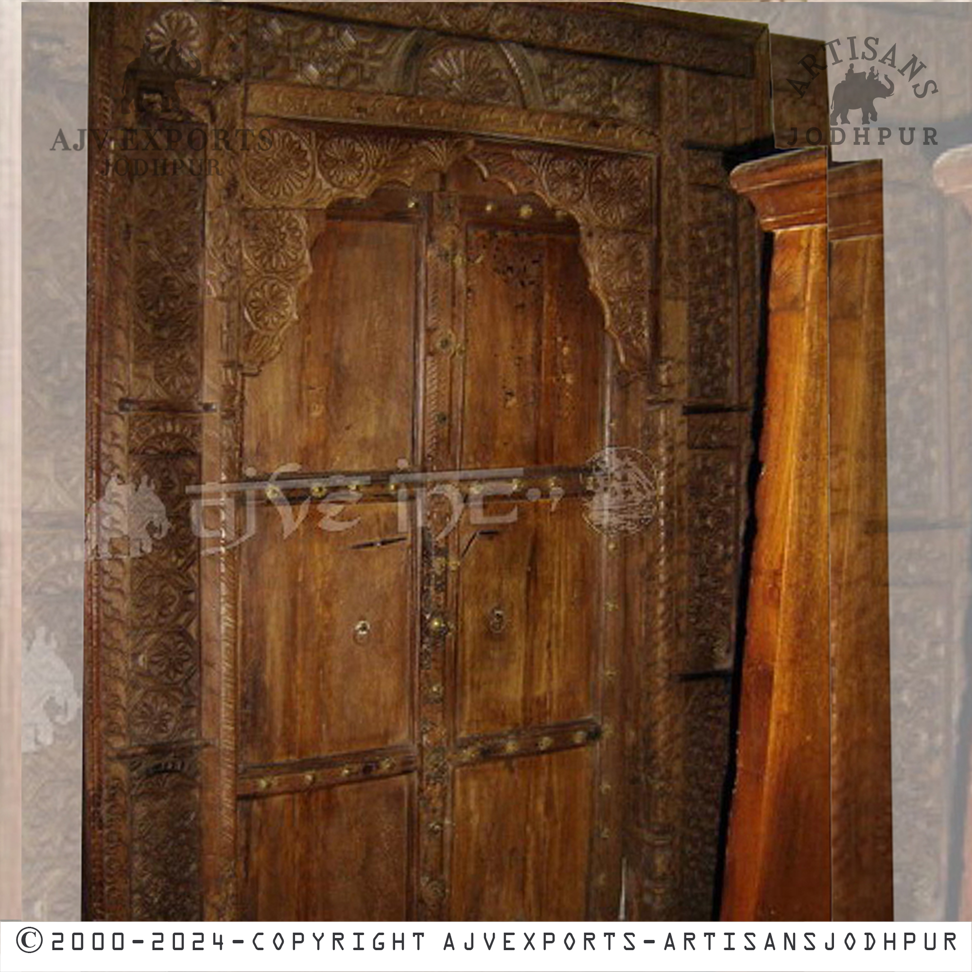 Traditional wooden door with metal accents and a rustic design, perfect for historic or classic interior settings.